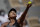 Japan's Naomi Osaka serves the ball to Romania's Patricia Maria Tig during their first round match of the French open tennis tournament at the Roland Garros stadium Sunday, May 30, 2021 in Paris. (AP Photo/Christophe Ena)