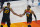 Utah Jazz's Rudy Gobert (27) congratulates Donovan Mitchell (45) after he scored against the Memphis Grizzlies during the first half of Game 5 of an NBA basketball first-round playoff series Wednesday, June 2, 2021, in Salt Lake City. (AP Photo/Rick Bowmer)