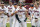 Virginia's Zack Gelof (18) celebrates his eighth inning home run with Christian Hlinka, left, Logan Michaels (12) and other teammates during an NCAA college baseball tournament super regional game against Dallas Baptist Saturday, June 13, 2021, in Columbia, S.C. Virginia won 4-0. (AP Photo/Sean Rayford)