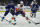 New York Islanders center Brock Nelson (29) moves the pu8ck in front of Tampa Bay Lightning center Blake Coleman (20) during the third period in Game 1 of an NHL hockey Stanley Cup semifinal playoff series Sunday, June 13, 2021, in Tampa, Fla. (AP Photo/Chris O'Meara)