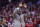 Former Wisconsin basketball player Michael Finley is honored during a timeout in an NCAA college basketball game between Wisconsin and Michigan Sunday, Feb. 28, 2016, in Madison, Wis. (AP Photo/Andy Manis)