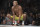 Anderson Silva, of Brazil, squats before a middleweight  mixed martial arts bout against Derek Brunson at UFC 208 Saturday, Feb. 11, 2017, in New York.  Silva won the fight. (AP Photo/Frank Franklin II)