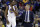 FILE - In this Nov. 23, 2016, file photo, Golden State Warriors' Kevin Durant, left, talks with coach Steve Kerr during the team's NBA basketball game against the Los Angeles Lakers in Oakland, Calif. Durant won’t play later Saturday, April 22, in Game 3 against the Portland Trail Blazers because of a strained left calf. The Warriors will also be without Kerr because of an illness. Mike Brown will serve as acting coach. (AP Photo/Marcio Jose Sanchez, File)