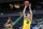 INDIANAPOLIS, INDIANA - MARCH 22: Joe Wieskamp #10 of the Iowa Hawkeyes shoots over Chandler Lawson #13 of the Oregon Ducks in the second round game of the 2021 NCAA Men's Basketball Tournament at Bankers Life Fieldhouse on March 22, 2021 in Indianapolis, Indiana. (Photo by Sarah Stier/Getty Images)