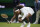 Serena Williams of the US falls to the ground during the women's singles first round match against Aliaksandra Sasnovich of Belarus on day two of the Wimbledon Tennis Championships in London, Tuesday June 29, 2021. (AP Photo/Kirsty Wigglesworth)