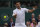 Serbia's Novak Djokovic plays a return to Hungary's Marton Fucsovics during the men's singles quarterfinals match on day nine of the Wimbledon Tennis Championships in London, Wednesday, July 7, 2021.(AP Photo/Kirsty Wigglesworth)