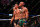 LAS VEGAS, NV - AUGUST 20:  (L-R) Nate Diaz and Conor McGregor of Ireland embrace after finishing five rounds in their welterweight bout during the UFC 202 event at T-Mobile Arena on August 20, 2016 in Las Vegas, Nevada. (Photo by Jeff Bottari/Zuffa LLC/Zuffa LLC via Getty Images)