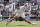 Serbia's Novak Djokovic plays a return to Italy's Matteo Berrettini during the men's singles final on day thirteen of the Wimbledon Tennis Championships in London, Sunday, July 11, 2021. (AP Photo/Kirsty Wigglesworth)