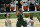 Milwaukee Bucks forward Giannis Antetokounmpo (34) dunks on Phoenix Suns forward Frank Kaminsky (8) and Jae Crowder (99) during the second half of Game 3 of basketball's NBA Finals in Milwaukee, Sunday, July 11, 2021. (AP Photo/Paul Sancya)