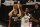 Milwaukee Bucks forward Khris Middleton (22) guards against Miami Heat guard Duncan Robinson (55) during the first half of Game 2 of their NBA basketball first-round playoff series Monday, May 24, 2021, in Milwaukee. (AP Photo/Jeffrey Phelps)