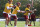 RICHMOND, VIRGINIA - JULY 29: (L-R) Kyle Allen #8, Taylor Heinicke #4 and Ryan Fitzpatrick #14 of the Washington Football Team take part in a quarterback drill during training camp at the Bon Secours Washington Football Team training center park on July 29, 2021 in Richmond, Virginia. (Photo by Kevin Dietsch/Getty Images)