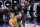 Los Angeles Lakers' Mac McClung, left, and Sacramento Kings; Davion Mitchell go for the ball during the first half of an NBA summer league basketball game in Sacramento, Calif., Wednesday, Aug. 4, 2021. (AP Photo/Rich Pedroncelli)