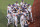 USA's baseball team players and coaches gather in front of dugout prior to the Tokyo 2020 Olympic Games baseball round 2 game between USA and Japan at Yokohama Baseball Stadium in Yokohama, Japan, on August 2, 2021. (Photo by KAZUHIRO FUJIHARA / AFP) (Photo by KAZUHIRO FUJIHARA/AFP via Getty Images)