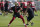 San Francisco 49ers quarterback Trey Lance throws a pass in front of quarterbacks coach Rich Scangarello at NFL football training camp in Santa Clara, Calif., Thursday, July 29, 2021. (AP Photo/Jeff Chiu)