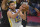 FILE - In this April 15, 2021, file photo, Golden State Warriors' Stephen Curry (30) goes to the basket against Cleveland Cavaliers' Jarrett Allen (31) and Isaac Okoro during the second half of an NBA basketball game in Cleveland. Curry has landed the second $200 million contract of his career, reaching agreement on a $215 million, four-year extension with the Warriors on Tuesday, Aug. 3. (AP Photo/David Dermer, File)