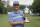 Kevin Kisner poses with the trophy after he sunk a birdie putt on the second playoff hole to win the Wyndham Championship golf tournament at Sedgefield Country Club in Greensboro, N.C., Sunday, Aug. 15, 2021. (AP Photo/Chris Seward)
