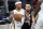 Brooklyn Nets' Chris Chiozza (4) defends New Orleans Pelicans' Isaiah Thomas (24) during the first half of an NBA basketball game Wednesday, April 7, 2021, in New York. (AP Photo/Frank Franklin II)