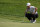 Justin Thomas lines up his shot on the eighth green in the first round of play at the Northern Trust golf tournament, Thursday, Aug. 19, 2021, at Liberty National Golf Course in Jersey City, N.J. (AP Photo/John Minchillo)