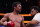Manny Pacquiao, of the Philippines, waits in the ring with a trainer after losing his fight to Yordenis Ugas, of Cuba, in a welterweight championship boxing match Saturday, Aug. 21, 2021, in Las Vegas. (AP Photo/John Locher)