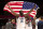 Basketball: 2020 Summer Olympics: USA Draymond Green (14) victorious holding up  USA flag after Men's Final vs France at Saitama Super Arena. USA wins gold. Tokyo, Japan 8/7/2021 CREDIT: Erick W. Rasco/Sports Illustrated via Getty Images) (Set Number: X163748 TK1)