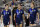 FILE - In this June 13, 2021, file photo, United States defender Kelley O'Hara (5), forward Alex Morgan (13) and midfielder Kristie Mewis (22) walk onto the field before their soccer game against Jamaica in Houston. Morgan says the U.S. women's national team needs to make sure players aren't losing any compensation they currently receive under U.S. Soccer's identical contract proposals for both the men's and women's teams. But the team is hopeful for a new collective bargaining agreement that will address players' concerns about equitable pay, she said. (AP Photo/Michael Wyke, File)