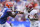 GAINESVILLE, FLORIDA - SEPTEMBER 18: John Metchie III #8 of the Alabama Crimson Tide runs for yardage against Tre'Vez Johnson #16 of the Florida Gators during the first quarter of a game at Ben Hill Griffin Stadium on September 18, 2021 in Gainesville, Florida. (Photo by James Gilbert/Getty Images)