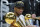 FILE - In this July 20, 2021, file photo, Milwaukee Bucks forward Giannis Antetokounmpo holds the NBA Championship trophy, left, and Most Valuable Player trophy after defeating the Phoenix Suns in Game 6 of basketball's NBA Finals in Milwaukee. One month after leading the Bucks to their first NBA title in half a century, Antetokounmpo is teaming up with the city’s other major pro sports franchise by joining the Milwaukee Brewers’ ownership group. (AP Photo/Paul Sancya, File)