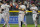 San Francisco Giants shortstop Brandon Crawford, front center, celebrates with from left, third baseman Evan Longoria, first baseman Brandon Belt and second baseman Tommy La Stella after the ninth inning of a baseball game against the Colorado Rockies Friday, Sept. 24, 2021, in Denver. The Giants won 7-2. (AP Photo/David Zalubowski)