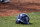 A Tampa Bay Rays helmet sits on the field by the batting cage as players participate in batting practice at baseball spring training in Port Charlotte Fla., Monday March 2, 2015. (AP Photo/Tony Gutierrez)