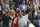 Switzerland's Roger Federer leaves the court after losing to Poland's Hubert Hurkacz during the men's singles quarterfinals match on day nine of the Wimbledon Tennis Championships in London, Wednesday, July 7, 2021. (AP Photo/Alberto Pezzali)