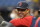Boston Red Sox manager Alex Cora watches batting practice before Game 2 of a baseball American League Division Series against the Tampa Bay Rays, Friday, Oct. 8, 2021, in St. Petersburg, Fla. (AP Photo/Steve Helber)