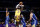 Los Angeles Lakers forward LeBron James shoots over Golden State Warriors guard Gary Payton II, second from right, during the first half of a preseason NBA basketball game in Los Angeles, Tuesday, Oct. 12, 2021. (AP Photo/Ringo H.W. Chiu)