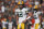 Green Bay Packers quarterback Aaron Rodgers (12) looks to the sidelines during an NFL football game against the Cincinnati Bengals, Sunday, Oct. 10, 2021, in Cincinnati. (AP Photo/Zach Bolinger)