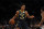 Indiana Pacers guard Malcolm Brogdon (7) dribbles the ball against the New York Knicks during the first half of a preseason NBA basketball game Tuesday, Oct. 5, 2021, in New York. (AP Photo/Adam Hunger)