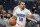Orlando Magic guard Cole Anthony moves the ball ab= during the first half of an NBA preseason basketball game, Wednesday, Oct. 13, 2021, in Orlando, Fla. (AP Photo/John Raoux)