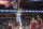 Memphis Grizzlies guard Ja Morant (12) goes to the basket as Cleveland Cavaliers guard Ricky Rubio (3), forward Kevin Love (0) and center Evan Mobley (4) watch during the second half of an NBA basketball game Wednesday, Oct. 20, 2021, in Memphis, Tenn. (AP Photo/Nikki Boertman)