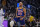 Golden State Warriors guard Stephen Curry (30) reacts after making a 3-point shot against the Los Angeles Clippers during the first half of an NBA basketball game in San Francisco, Thursday, Oct. 21, 2021. (AP Photo/Tony Avelar)