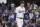 Los Angeles Dodgers starting pitcher Walker Buehler reacts on the mound at the end of the first inning of Game 4 against the San Francisco Giants in a baseball National League Division Series, Tuesday, Oct. 12, 2021, in Los Angeles. (AP Photo/Marcio Jose Sanchez)