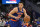 New York Knicks forward Kevin Knox II (20) in action during the second half of an NBA preseason basketball game against the Washington Wizards, Saturday, Oct. 9, 2021, in Washington. The Knicks won 117-99. (AP Photo/Nick Wass)