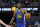 Golden State Warriors forward Andrew Wiggins (22) against the Oklahoma City Thunder during an NBA basketball game in San Francisco, Saturday, Oct. 30, 2021. (AP Photo/Jeff Chiu)