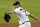 FILE- In this July 24, 2020, file photo, Houston Astros starting pitcher Justin Verlander throws against the Seattle Mariners during the first inning of a baseball game in Houston. The Astros announced Saturday, Sept. 19, 2020, that Verlander needs Tommy John surgery and could miss the entire 2021 season. (AP Photo/David J. Phillip, File)