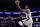 Milwaukee Bucks' Giannis Antetokounmpo, right, goes up for a shot during the first half of an NBA basketball game against the Philadelphia 76ers, Tuesday, Nov. 9, 2021, in Philadelphia. (AP Photo/Matt Slocum)