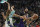 Los Angeles Lakers' Anthony Davis grabs a rebound in front of Milwaukee Bucks' Giannis Antetokounmpo during the first half of an NBA basketball game Wednesday, Nov. 17, 2021, in Milwaukee. (AP Photo/Morry Gash)