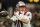 New England Patriots quarterback Mac Jones (10) works against the Atlanta Falcons during the first half of an NFL football game, Thursday, Nov. 18, 2021, in Atlanta. (AP Photo/Brynn Anderson)