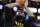Los Angeles Lakers' LeBron James warms up before an NBA basketball game against the Boston Celtics, Friday, Nov. 19, 2021, in Boston. (AP Photo/Michael Dwyer)