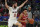 Wisconsin guard Johnny Davis drives on St. Mary's guard Logan Johnson (0) in the first half during an NCAA college basketball game at the Maui Invitational in Las Vegas, Wednesday, Nov. 24, 2021. (AP Photo/Rick Scuteri)