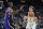 Indiana Pacers' Chris Duarte (3) prepares to shoot against Los Angeles Lakers' LeBron James (6) during the second half of an NBA basketball game Wednesday, Nov. 24, 2021, in Indianapolis. (AP Photo/Darron Cummings)