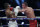 World Heavyweight boxing champion Britain's Anthony Joshua, left, sways back from a punch by challenger Bulgaria's Kubrat Pulev during their Heavyweight title fight at Wembley Arena in London Saturday, Dec. 12, 2020. (Andrew Couldridge/Pool via AP)