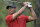 ARCHIVO - Tiger Woods observa su tiro en el cuarto hoyo durante la última ronda del torneo de golf PNC Championship, el 20 de diciembre de 2020, en Orlando, Florida. (AP Foto/Phelan M. Ebenhack, Archivo)