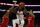 RALEIGH, NC - DECEMBER 01: North Carolina State Wolfpack guard Dereon Seabron (1) goes up for a shot between Nebraska Cornhuskers forward Derrick Walker (13) and Nebraska Cornhuskers guard Bryce McGowens (5) during the game between the North Carolina State Wolfpack and the Nebraska Cornhuskers at PNC Arena on December 1, 2021 in Raleigh, NC. (Photo by William Howard/Icon Sportswire via Getty Images)